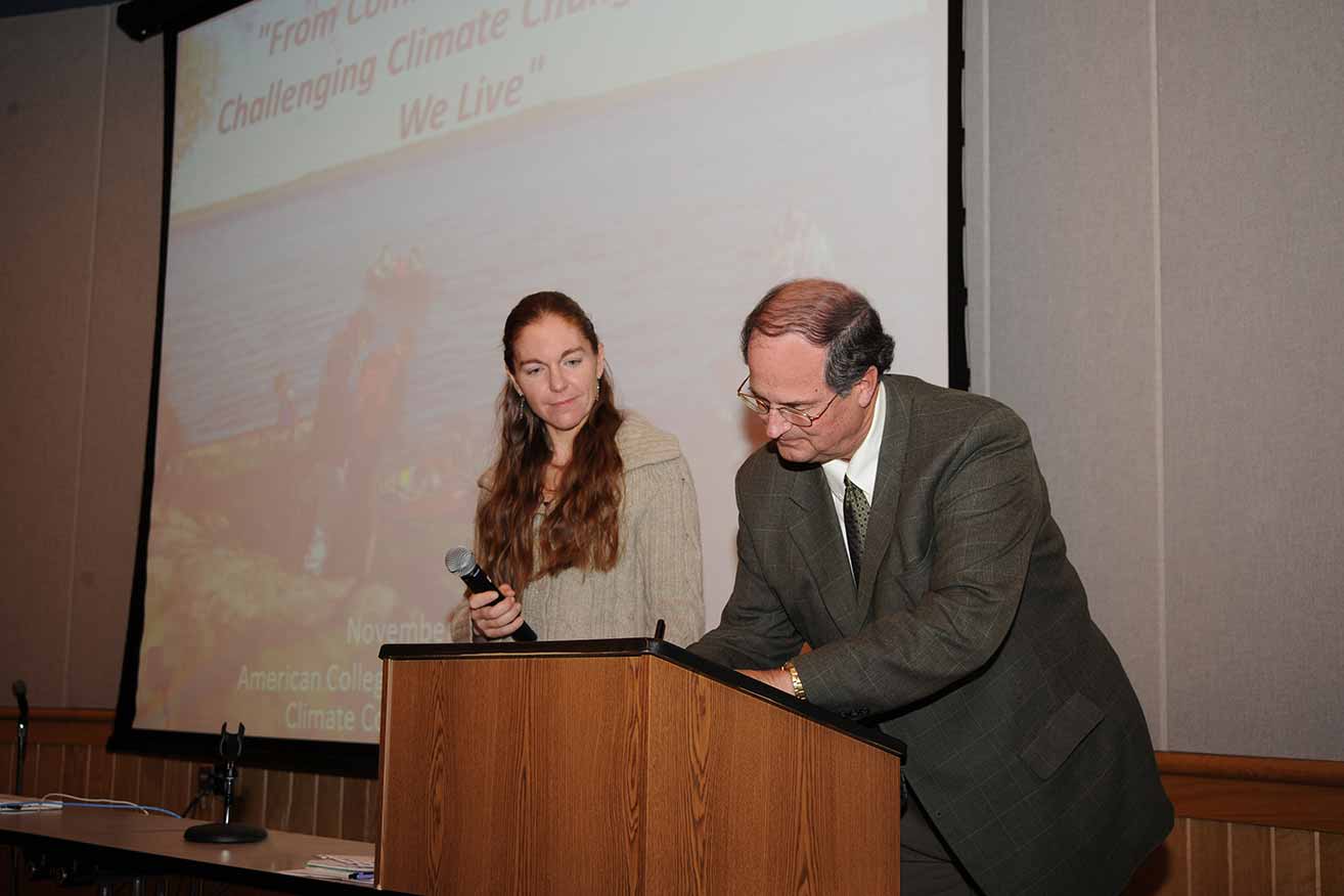 Dr. Jon Quistgaard signs the Presidents' Climate Commitment, 2008.
