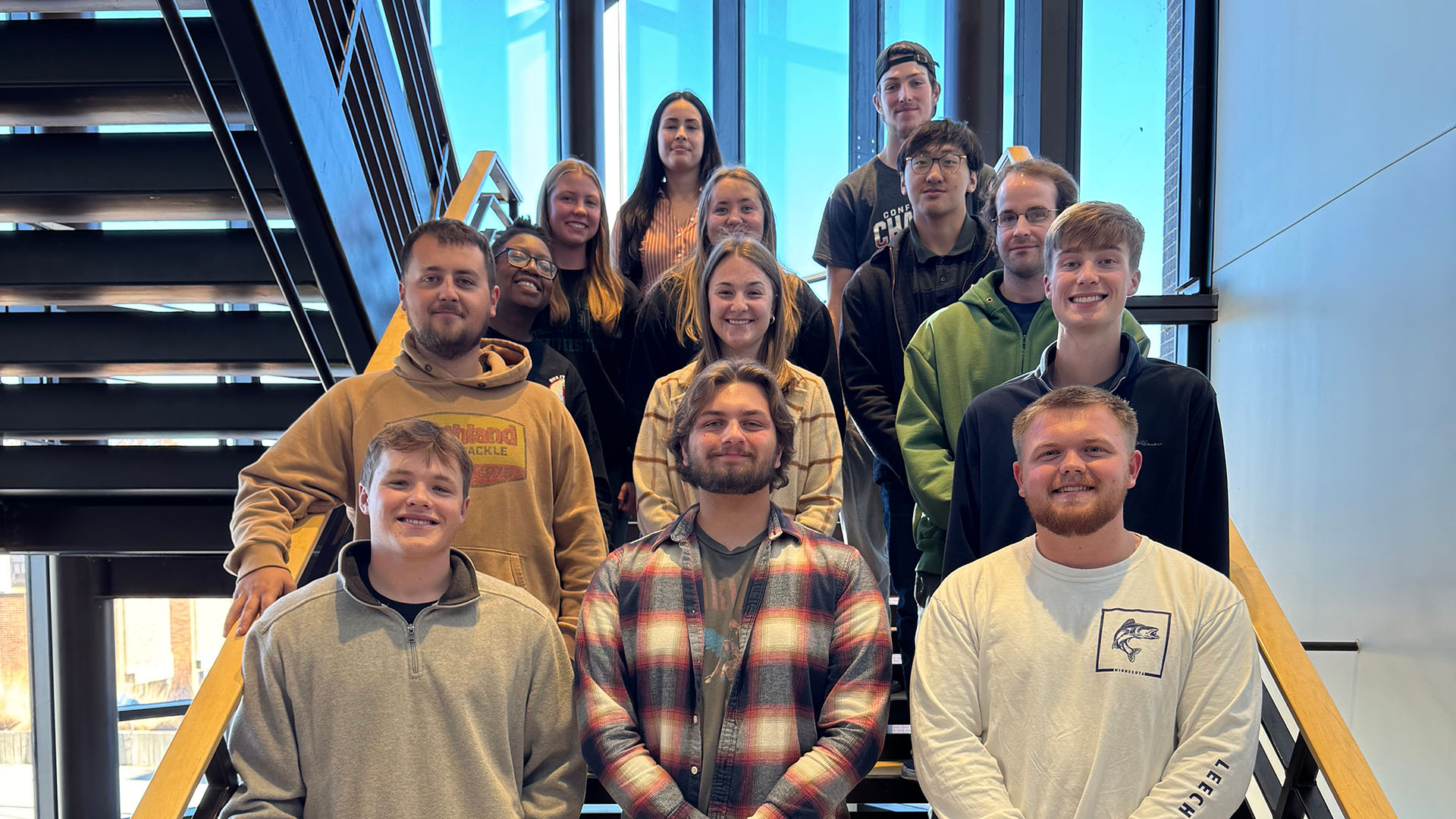 Members of BSU's Fall 2024 American Marketing Association club pose on the stairs in Memorial Hall