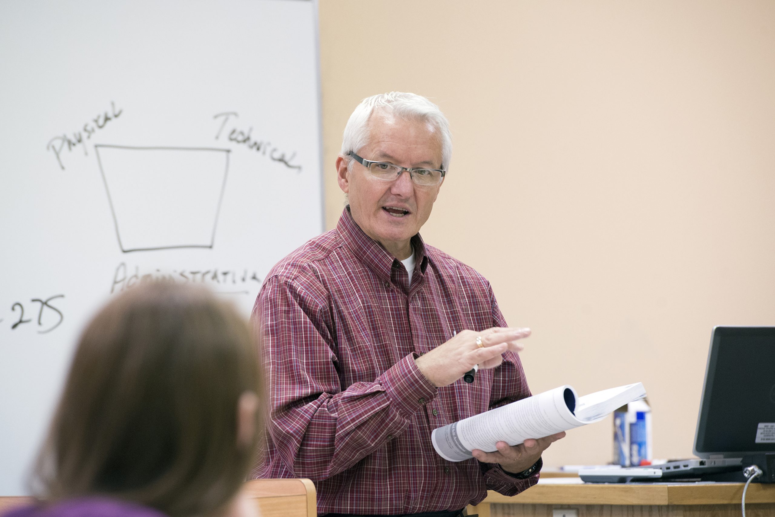 Dr. William Graves Teaching on a white board