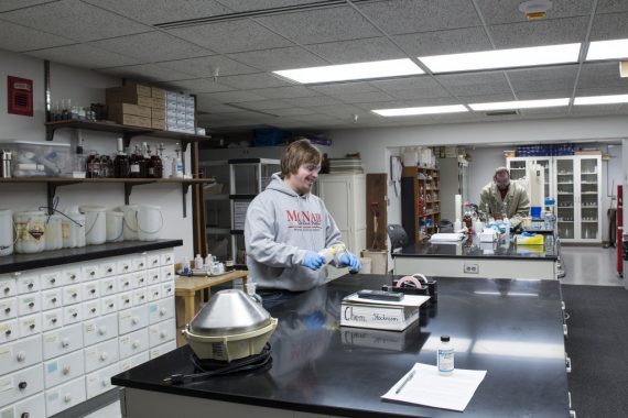 Student working in chemical stockroom