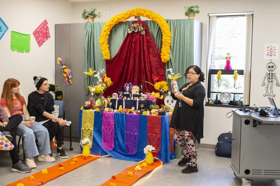 The Day of the Dead celebration in 2022, with students celebrating with decorations and food