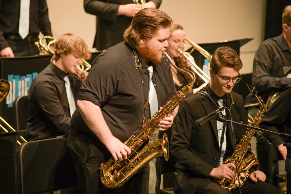 Bemidji State student playing a saxophone solo in the 2022 Blue Ice Jazz band concert