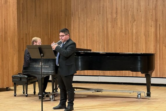 Student playing trumpet as part of their senior capstone