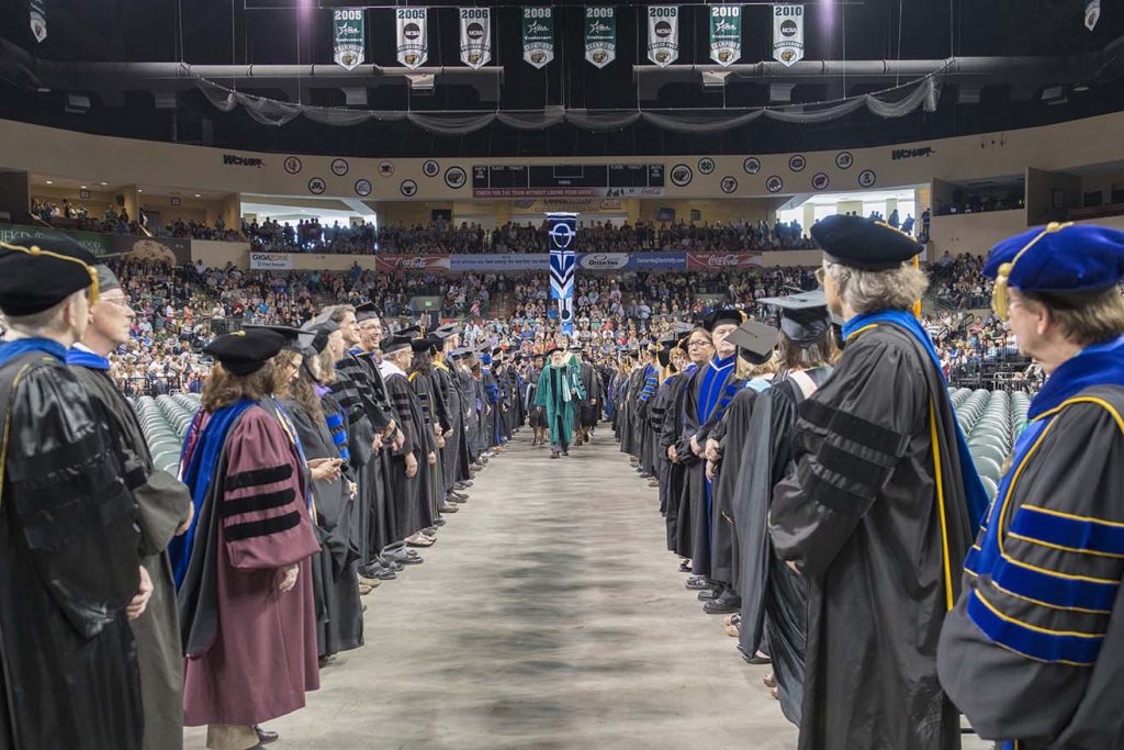 Covocation procession surrounded by faculty