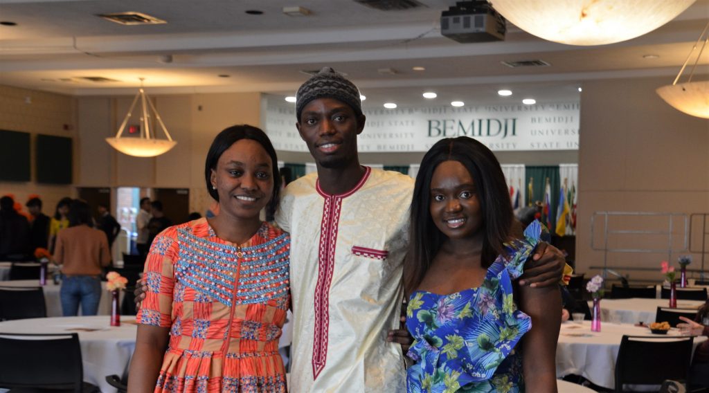 Three Students Posing in the ballroom