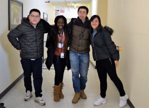 International Students posing in hallway