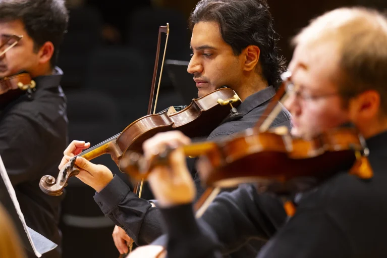 Violin players in black shirts