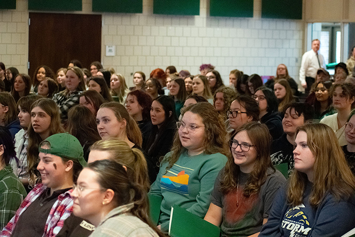 A group of high school students watching a performance at BSU Sings! Day