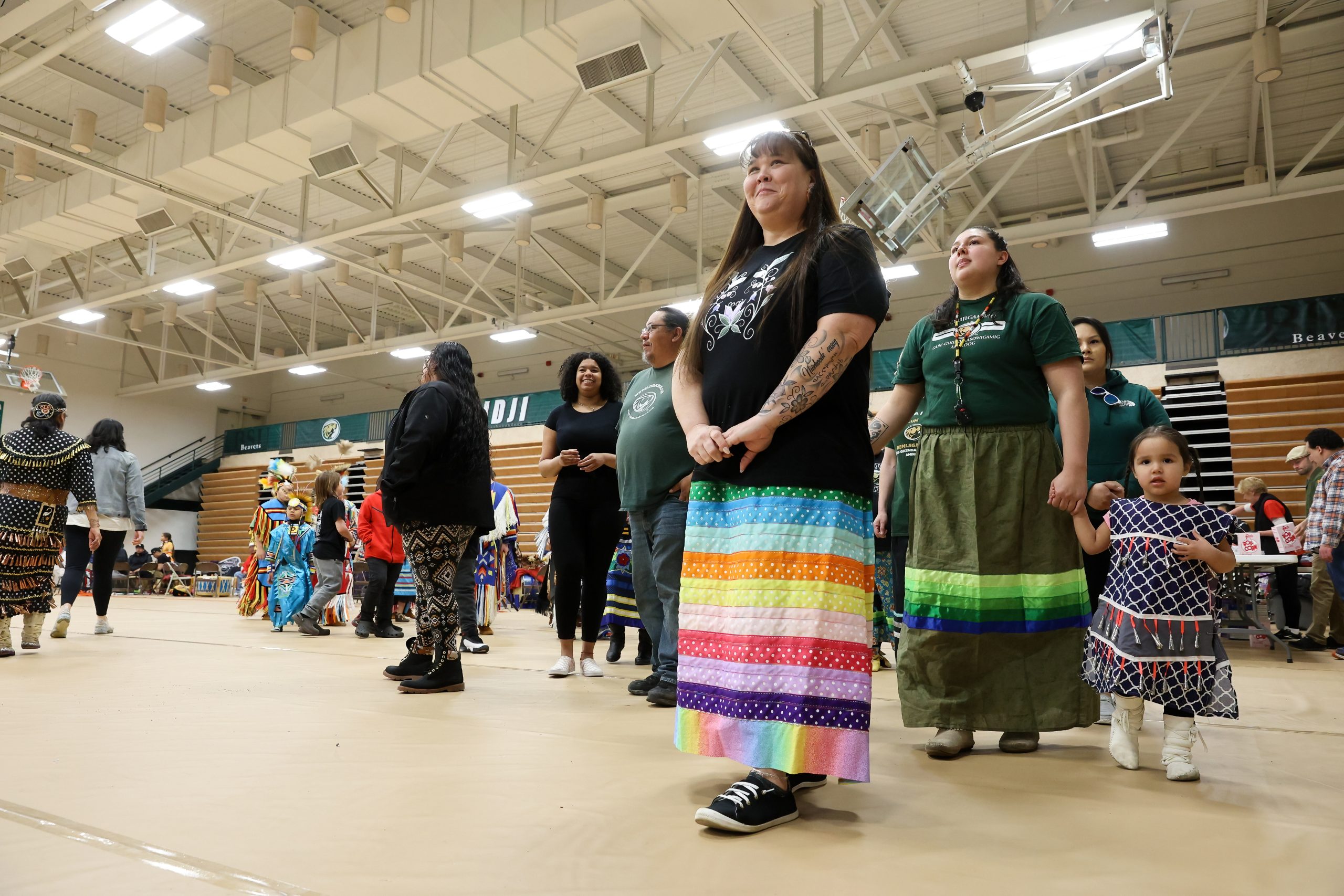 Chrissy Downwind standing in an auditorium during the 2023 BSU pow wow