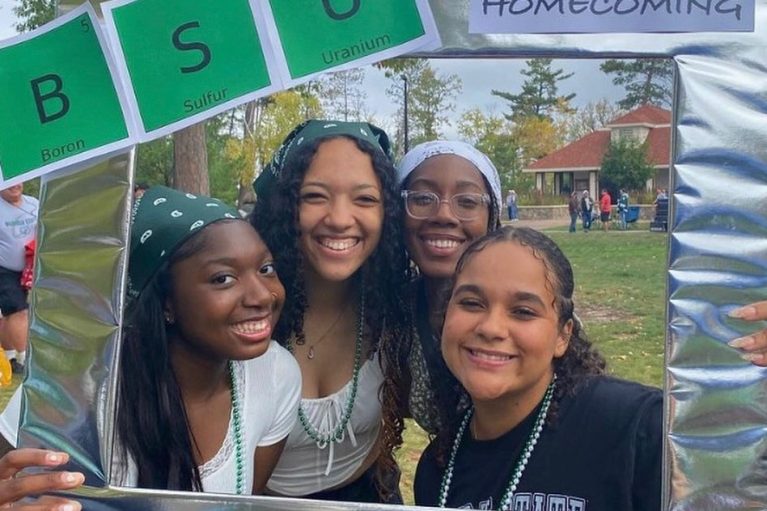 students at homecoming game looking over the grass