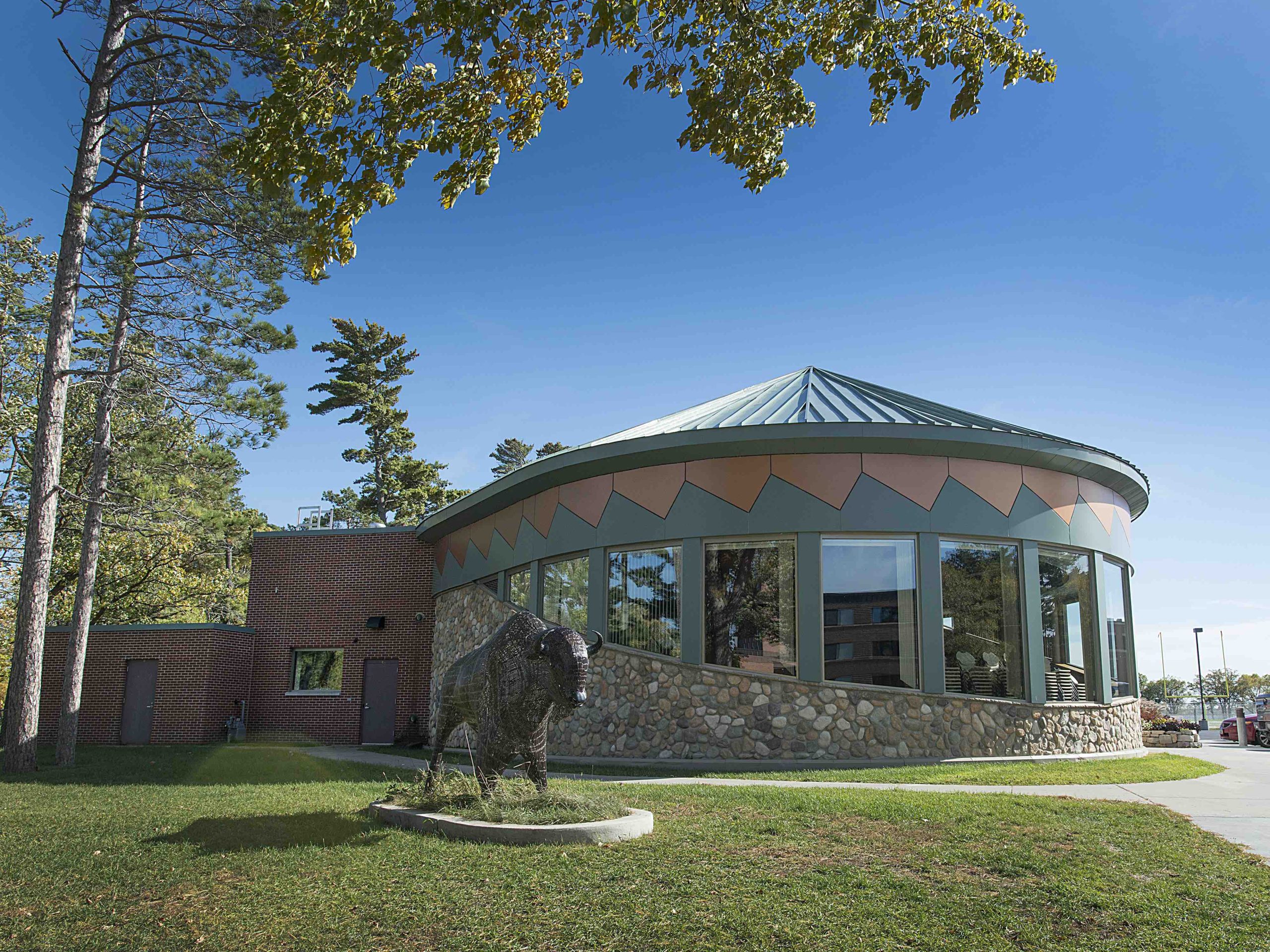 American Indian Resource Center with sculpture of bison in front
