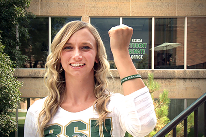 Student Senate President Brittany Hull shows off her Save Our Students bracelet in a student-produced video titled “Who’s Got Your Back?: No Buddy Left Behind.”