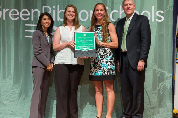 Dr. Anna Carlson, assistant director of sustainability (second from left), and Erika Bailey-Johnson, director of sustainability, receive a 2017 Green Ribbon Schools Award from the U.S. Department of Education on July 19 in Washington.