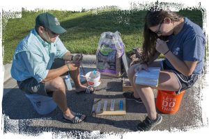 Dr. Brian Hiller records martin data with student McKenzie Ingram on July 14, 2017.