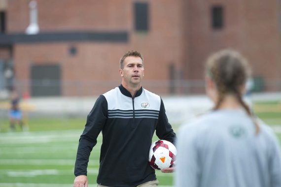 Coach Jim Stone preps the squad for its Sept. 16 home game against Upper Iowa University.
