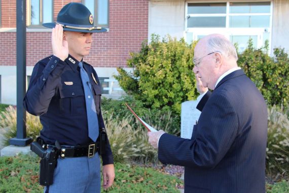 Nebraska Secretary of State John Gale administers the oath of office to John Bolduc '86 as the 18th superintendent of the Nebraska State Patrol on Oct. 16 in Lincoln, Neb.