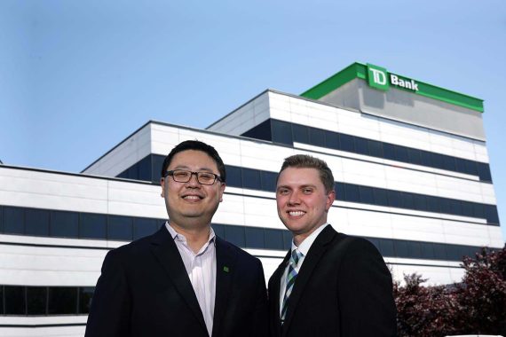 Xihao Hu '97, left, and Peter Hills '17 are pictured at TD Bank&rsquo;s U.S. headquarters in Cherry Hill, N.J.