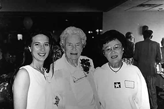 Suzy (Christianson) Langout, left, and her mother, Marion Christianson, right, join Dr. Myrtie Hunt at an event in her honor.