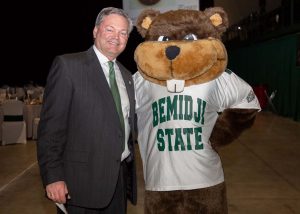 Director of Athletics Tracy Dill and Bucky.