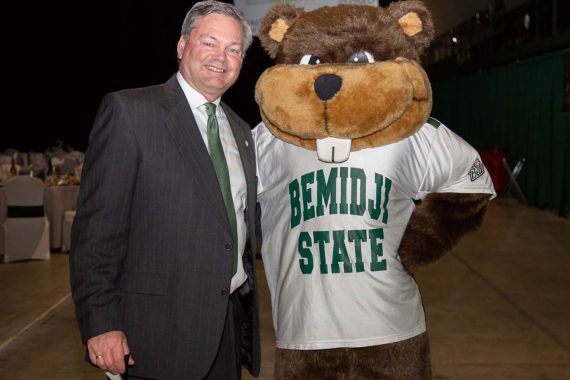 Director of Athletics Tracy Dill and Bucky.