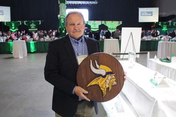 Jim McElmury '71 with his silent auction purchase.