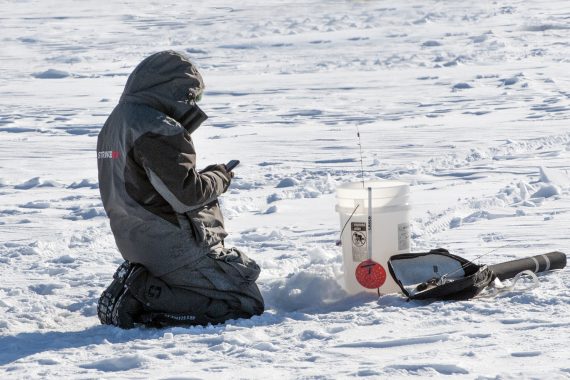 Participants enjoy ice fishing on Lake Bemidji.