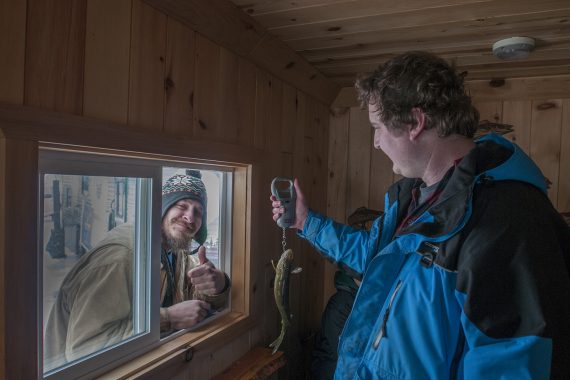Participants enjoy ice fishing on Lake Bemidji.