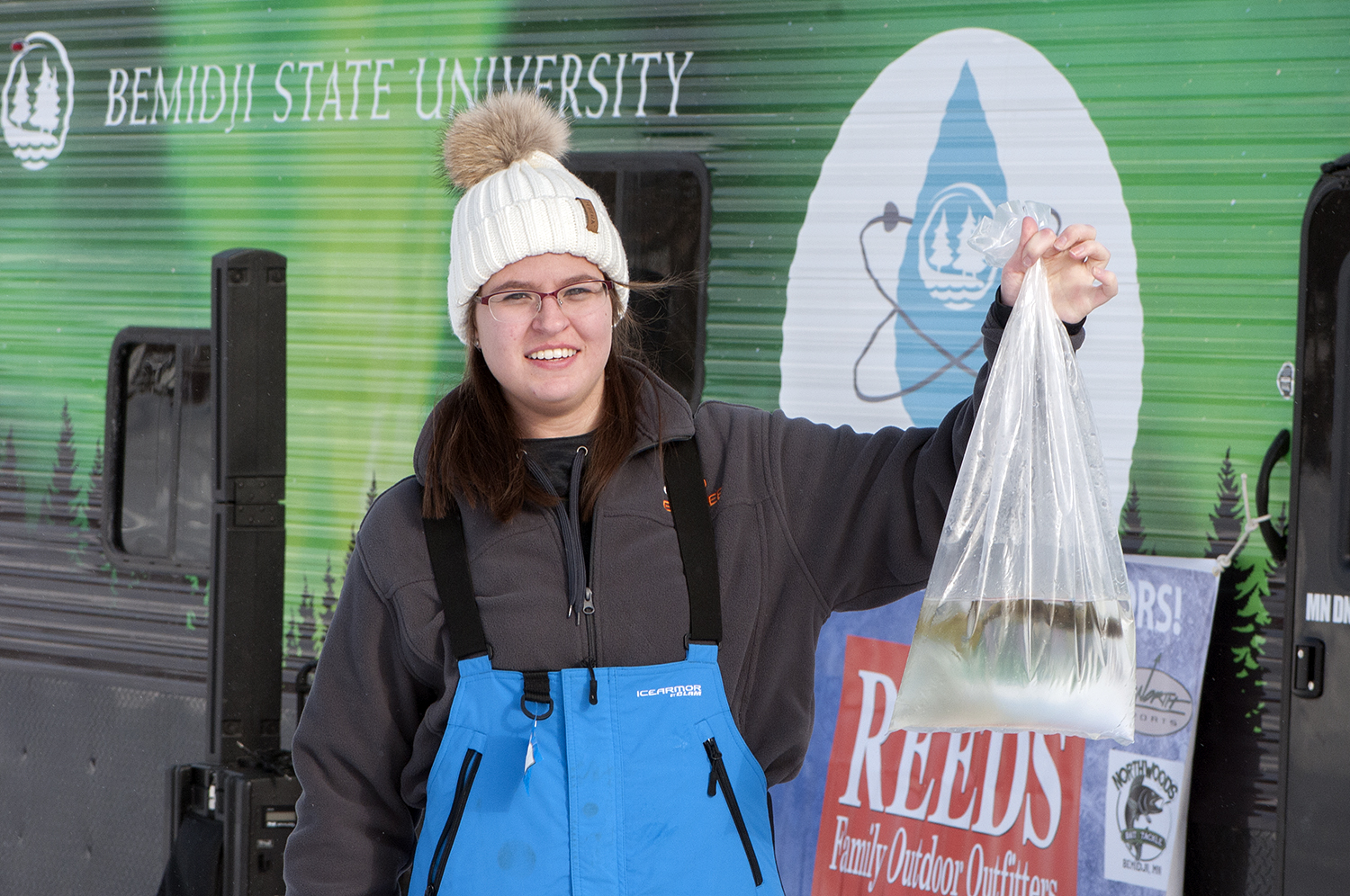 A participant showing off her catch of the day.