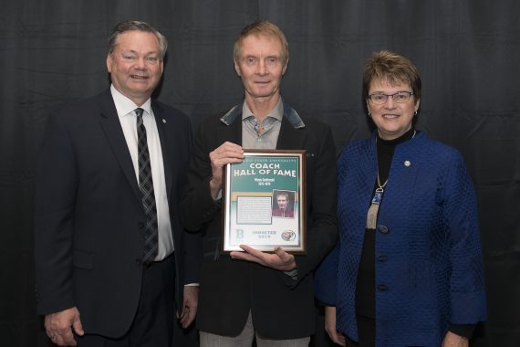 Tracy Dill, director of athletics, and President Faith Hensrud pictured with Wynn Gmitroski.