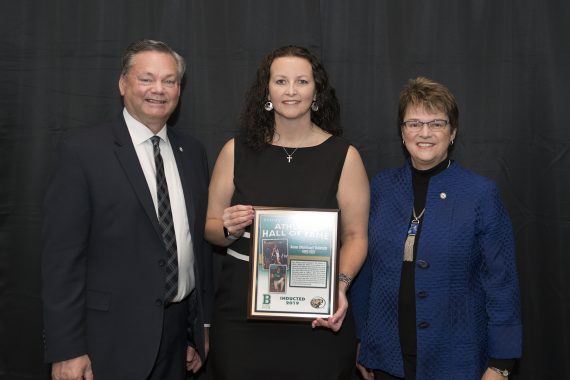Tracy Dill, director of athletics, and President Faith Hensrud pictured with Karen Morrisse