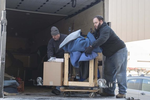 Schmitt's Music crew unloading BSU's Model B.