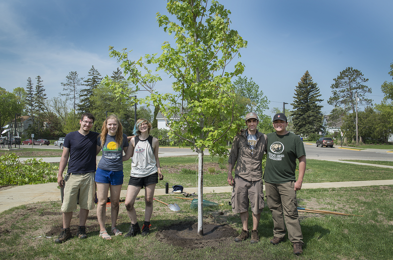 Jacob Haley, Anna Haynes, Skye Iwanski, Jordan Lutz and Benjamin Ng pictured in front of the Autumn blaze they planted.