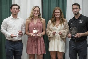 Students Ian Mackenzie-Olson and Megan Dahl receiving Female and Male Newcomers of the Year awards, and students Rachel Norton and Justin Baudry receiving Female and Male Student-Athletes of the Year awards.