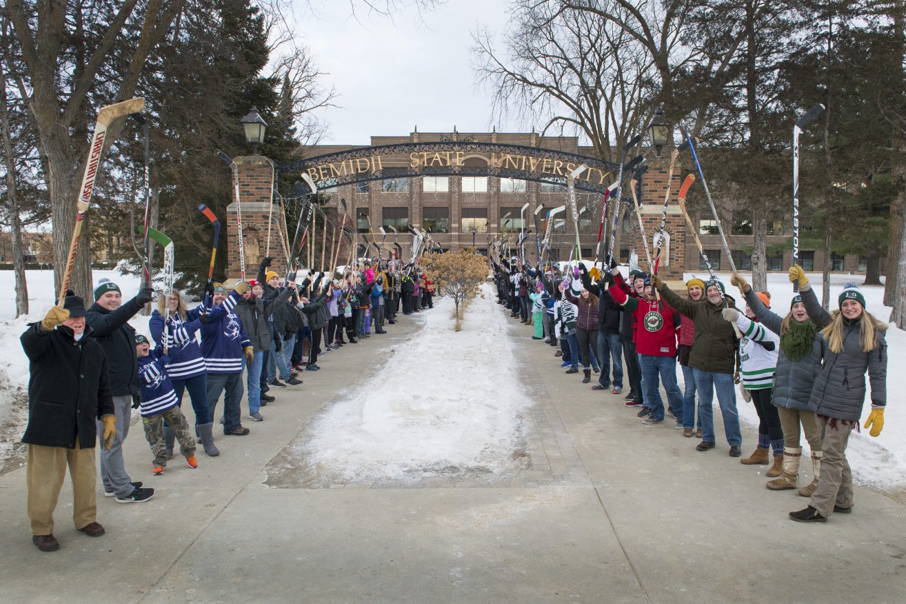 A hundred people gathered for the world's largest hockey stick salute for Hockey Day Minnesota weekend.