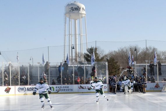 Hockey players on the ice during the Hockey Day Minnesota weekend.