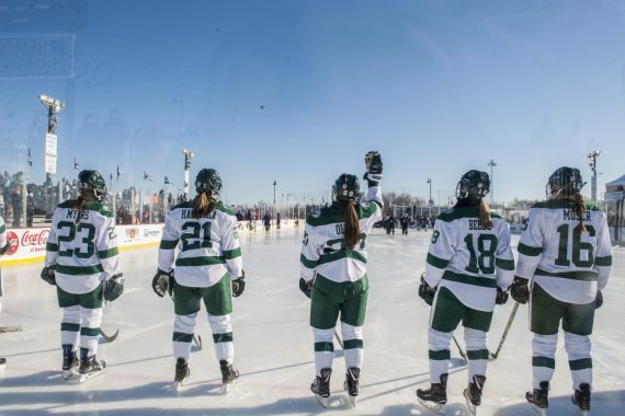 Members of the girls hockey team on the ice during the Hockey Day Minnesota weekend