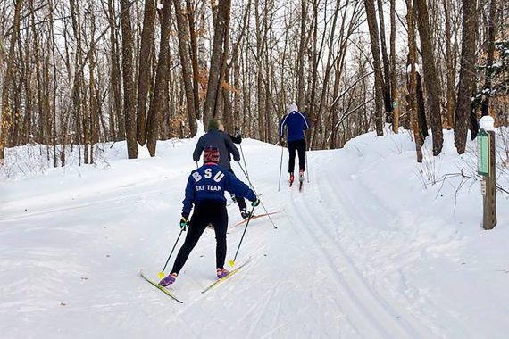 BSU alumni skiing.