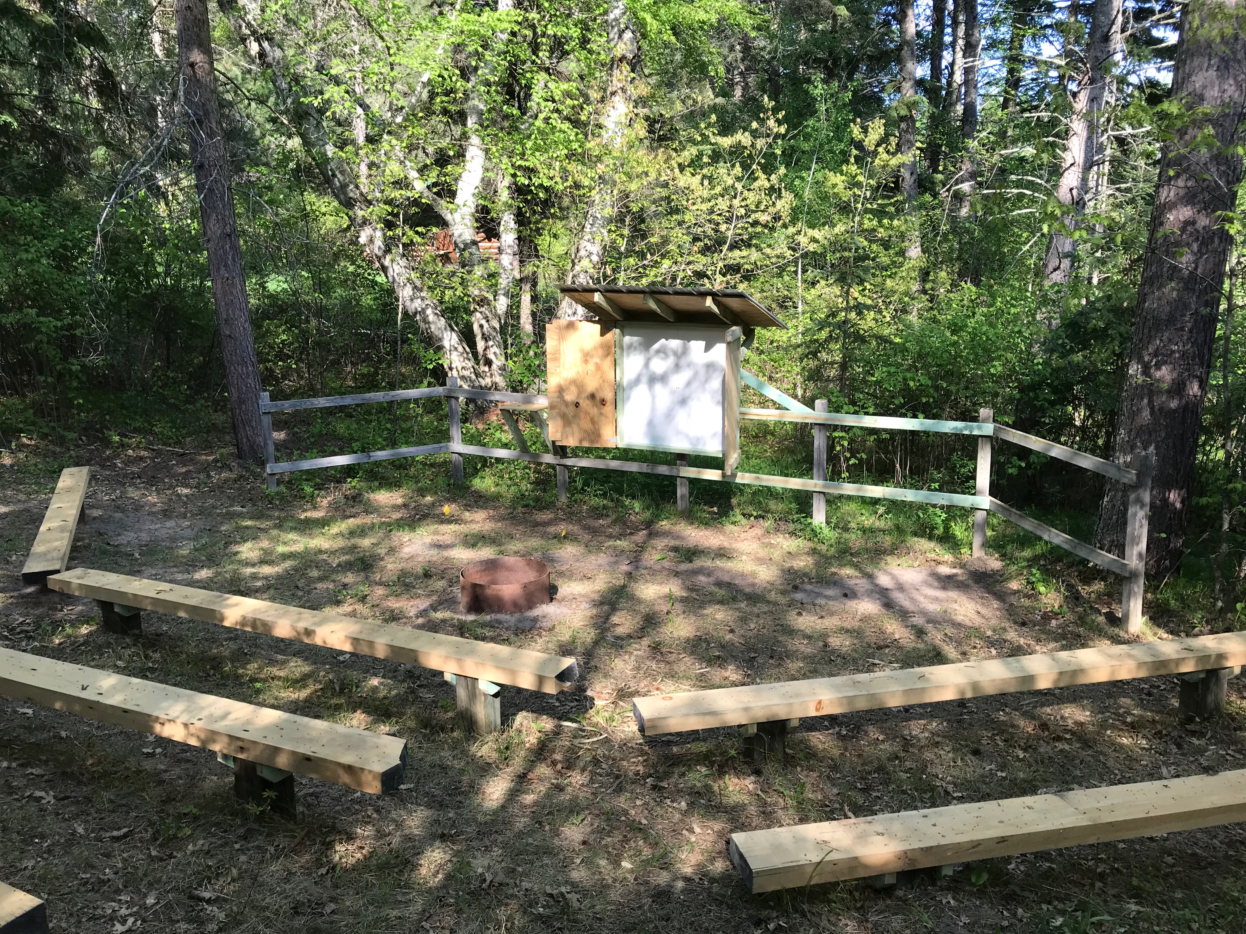 Hobson Memorial Forest renovated amphitheater and whiteboard.