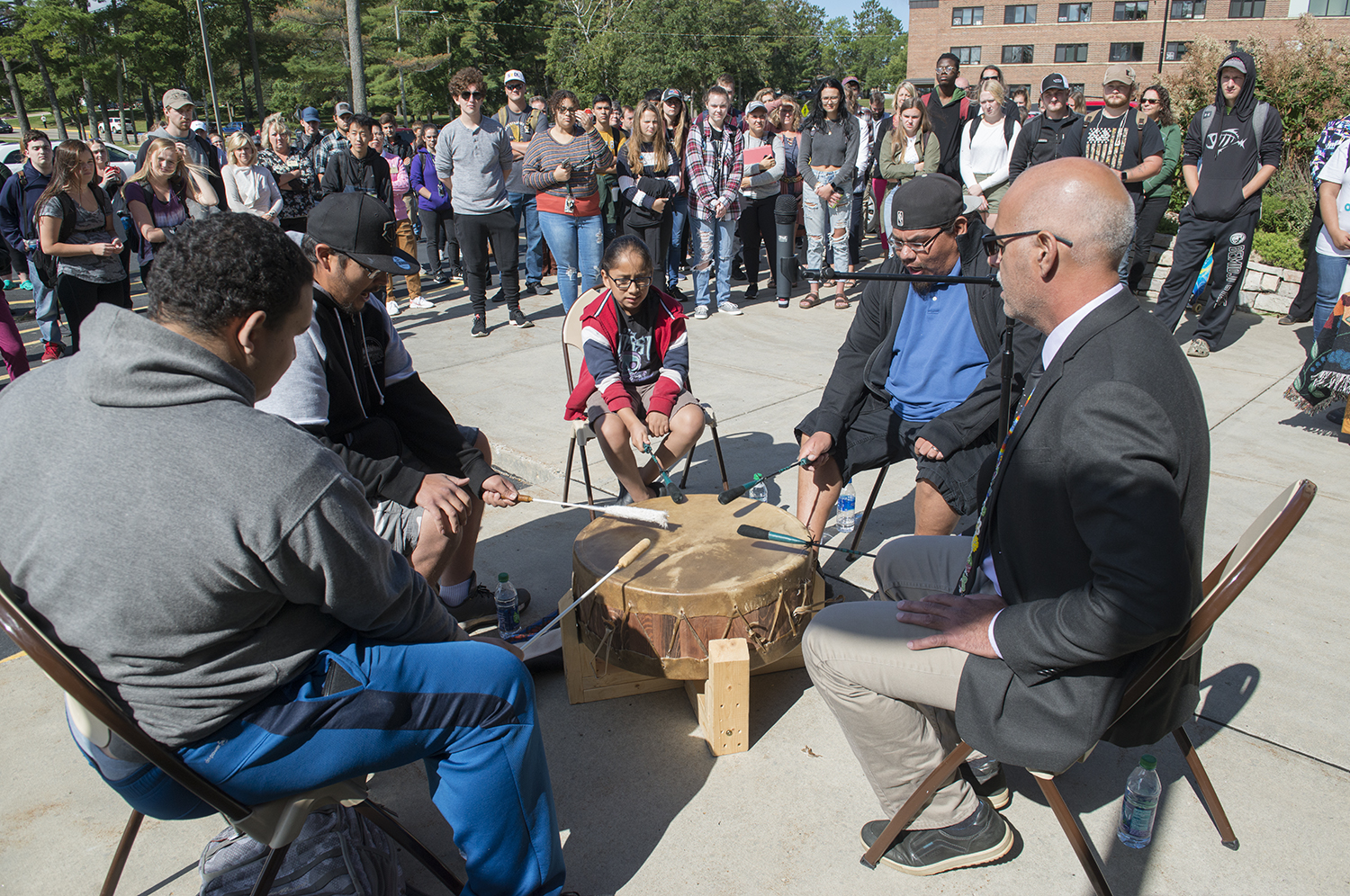 The Ojibwe Nation drum group plays an honor song at the Day of Welcome.