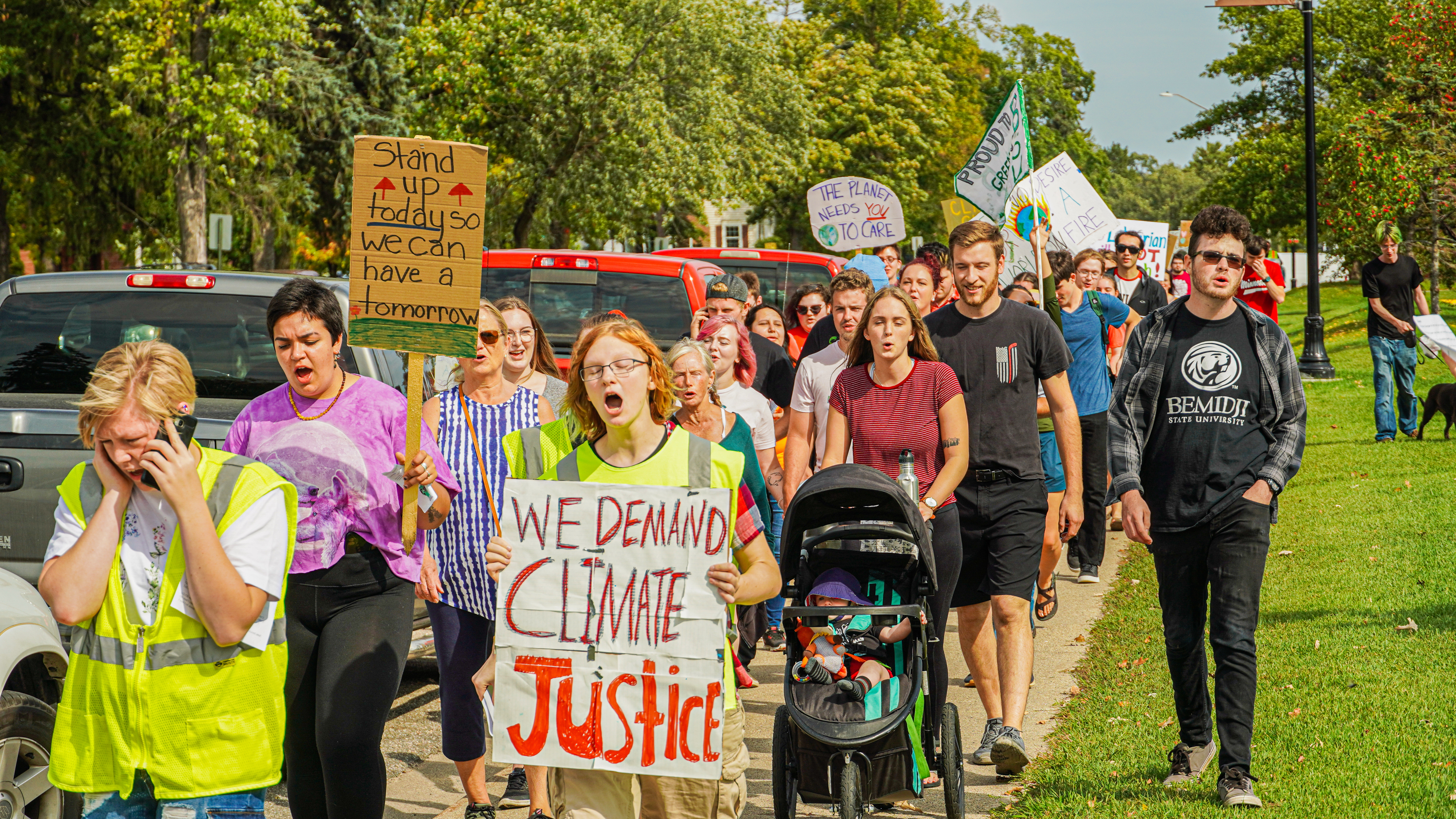 Participants walking to the Paul Bunyan Park during the climate march.
