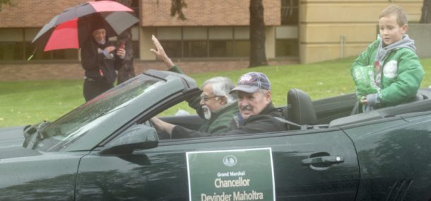 Devinder Malholtra, chancellor of Minnesota State, braved the elements in an open convertible as the parade’s grand marshal.
