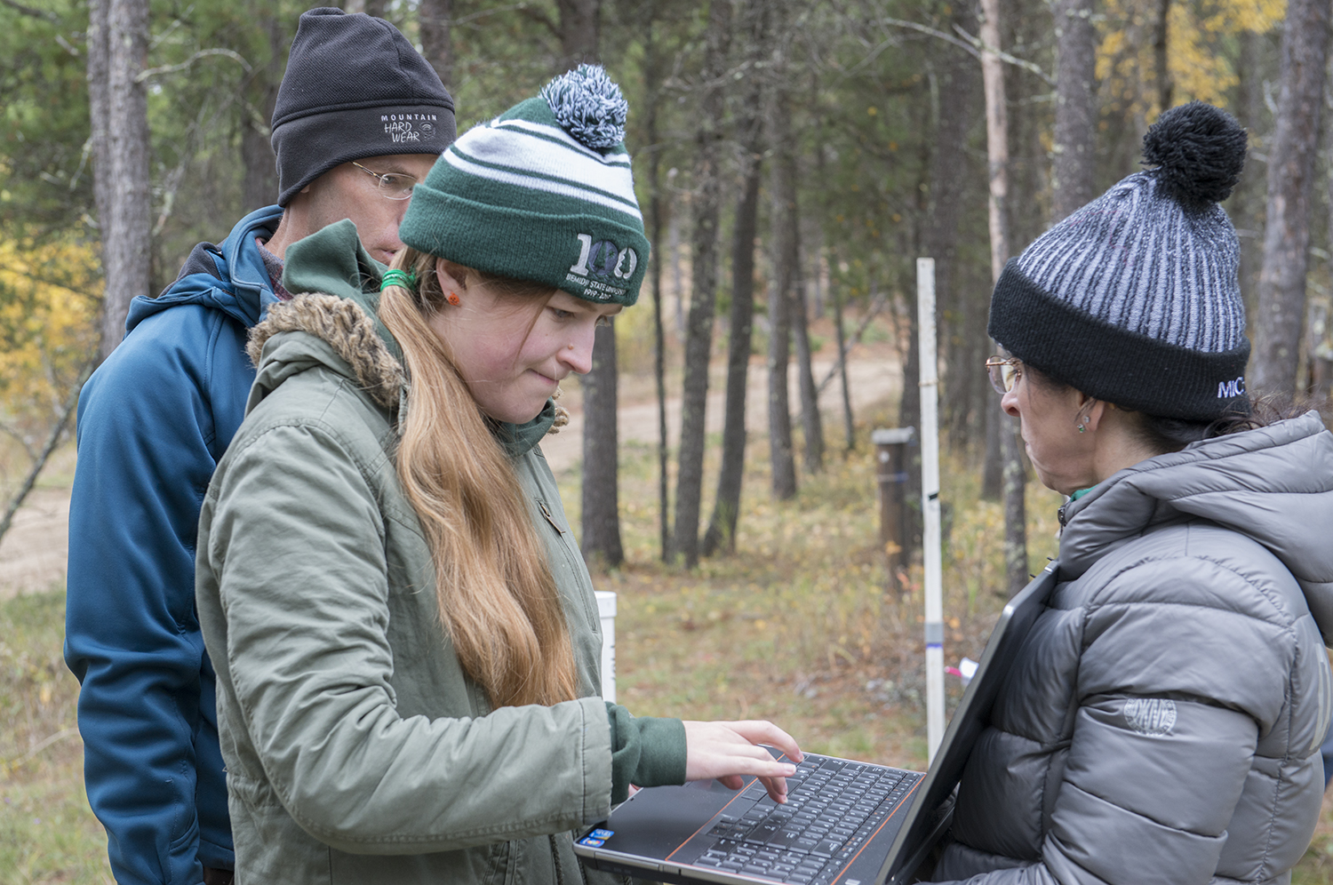 Students taking measurements of the magnetic susceptibility of the minerals.