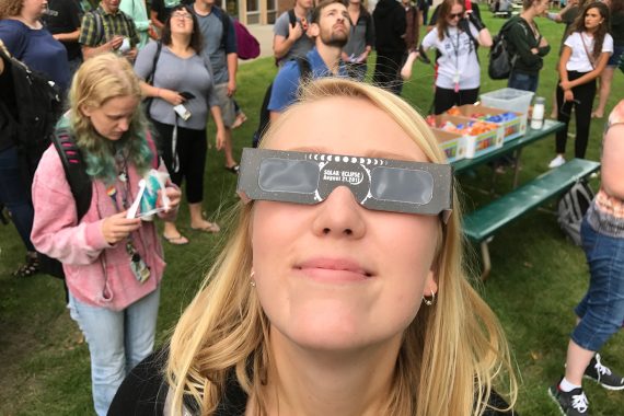 A student views the 2018 solar eclipse.