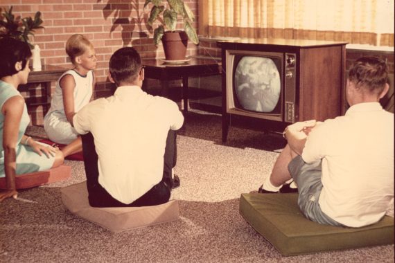 Students on campus watch television, 1960s.