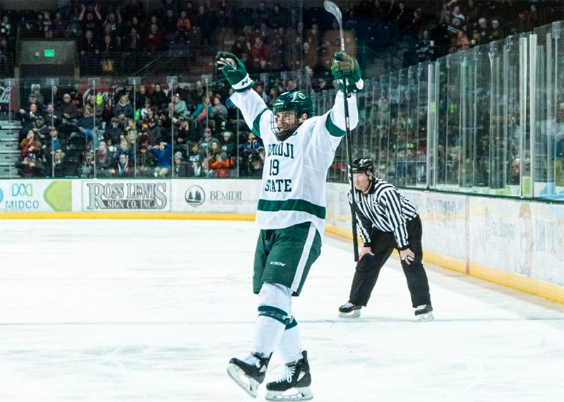 Adam Brady celebrating on the ice