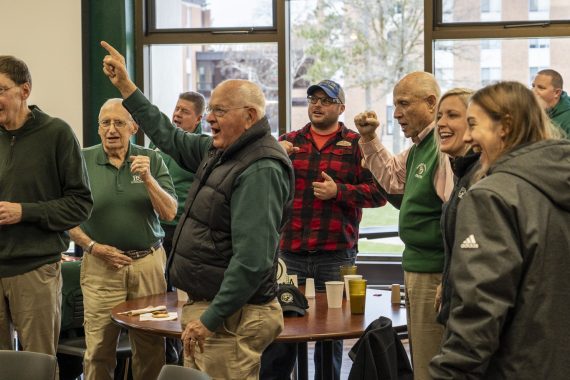 Former BSU president Jim Bensen &rsquo;59 leads the BSU fight song at a Beaver Pride Luncheon in Upper Deck.