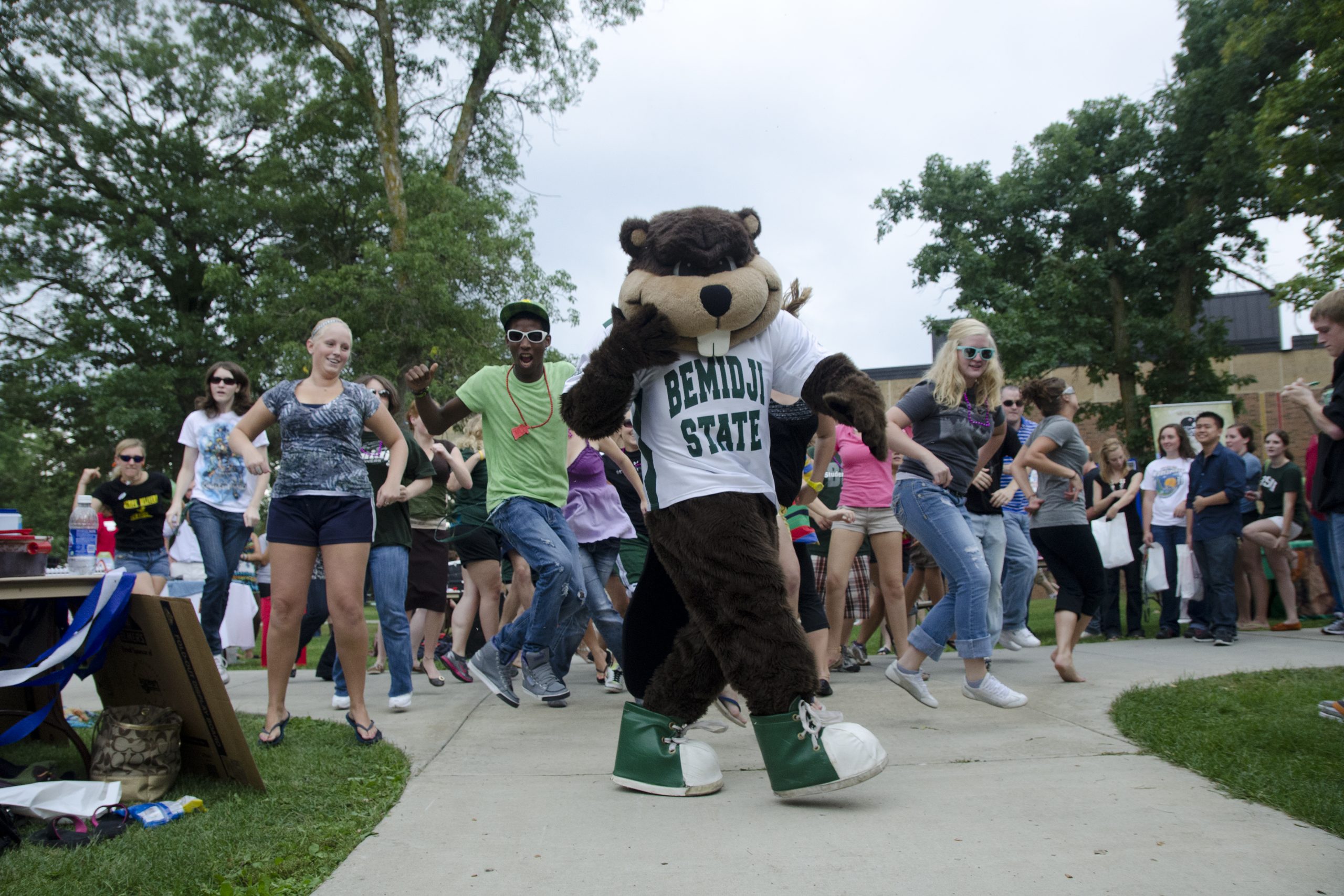 Bucky leads a dance party on campus.