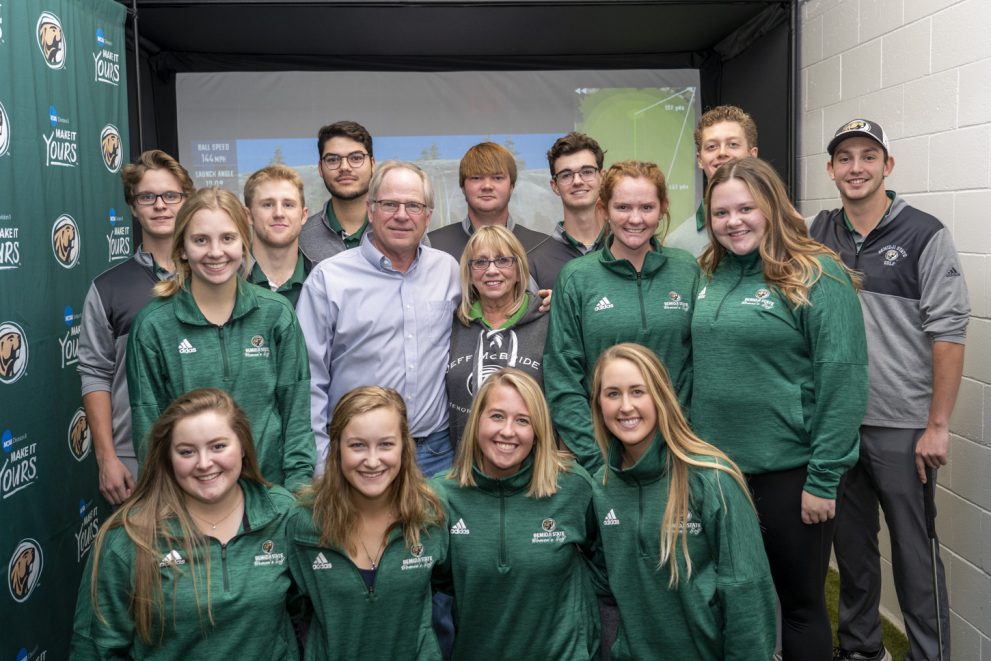 BSU golf teams pose with Gary and Ruth McBride at the dedication of the Jeff “Bird” McBride Clubhouse on Nov. 2