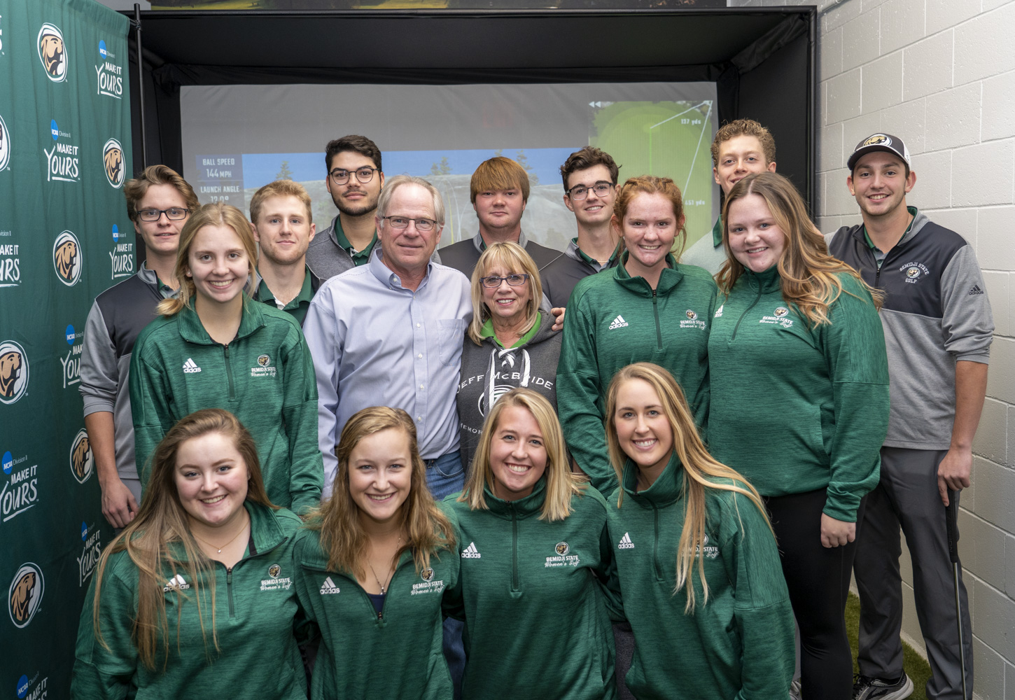 BSU golf teams pose with Gary and Ruth McBride at the dedication of the Jeff “Bird” McBride Clubhouse on Nov. 2