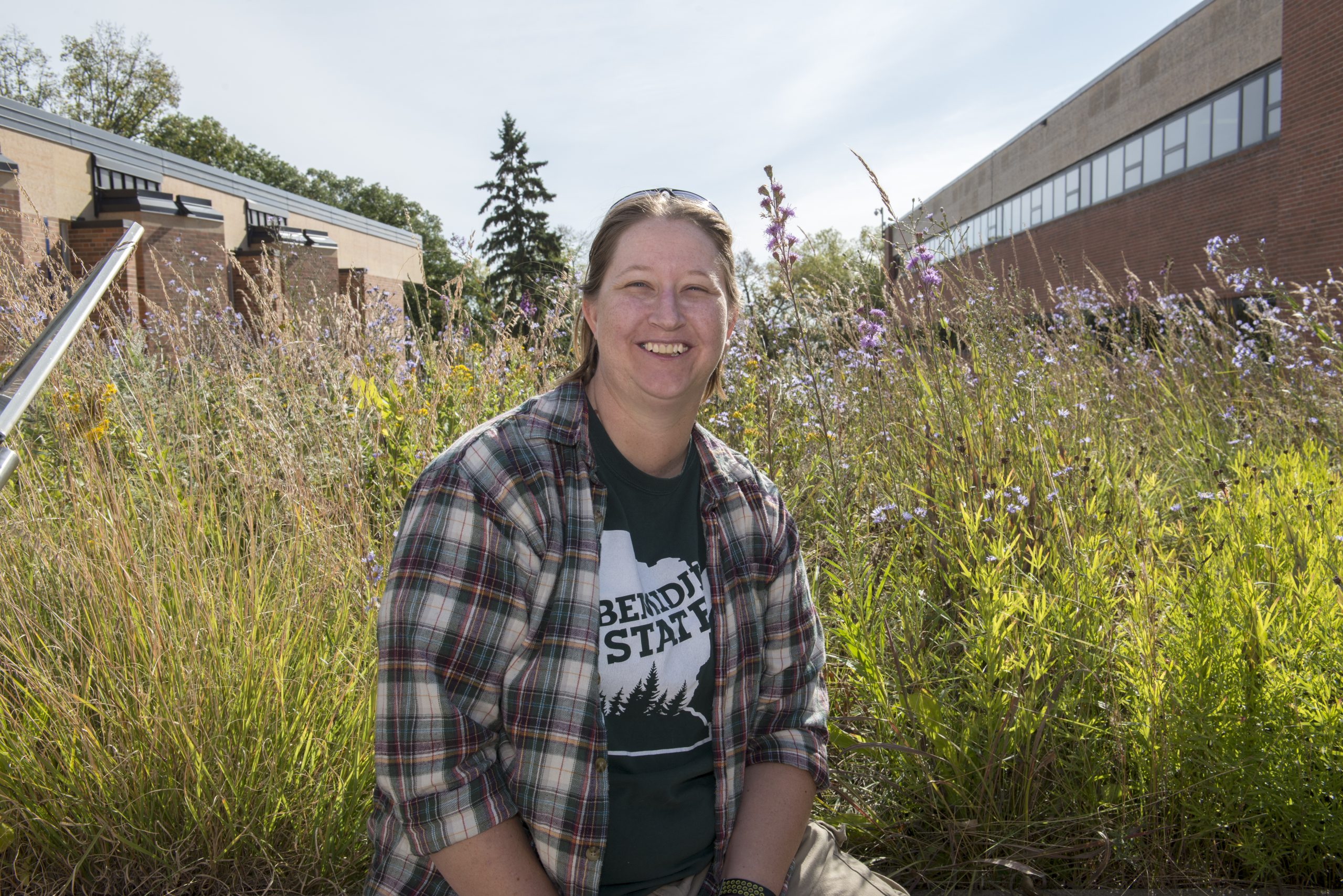 Rachel Schapp standing in front of the BSU butterfly garden